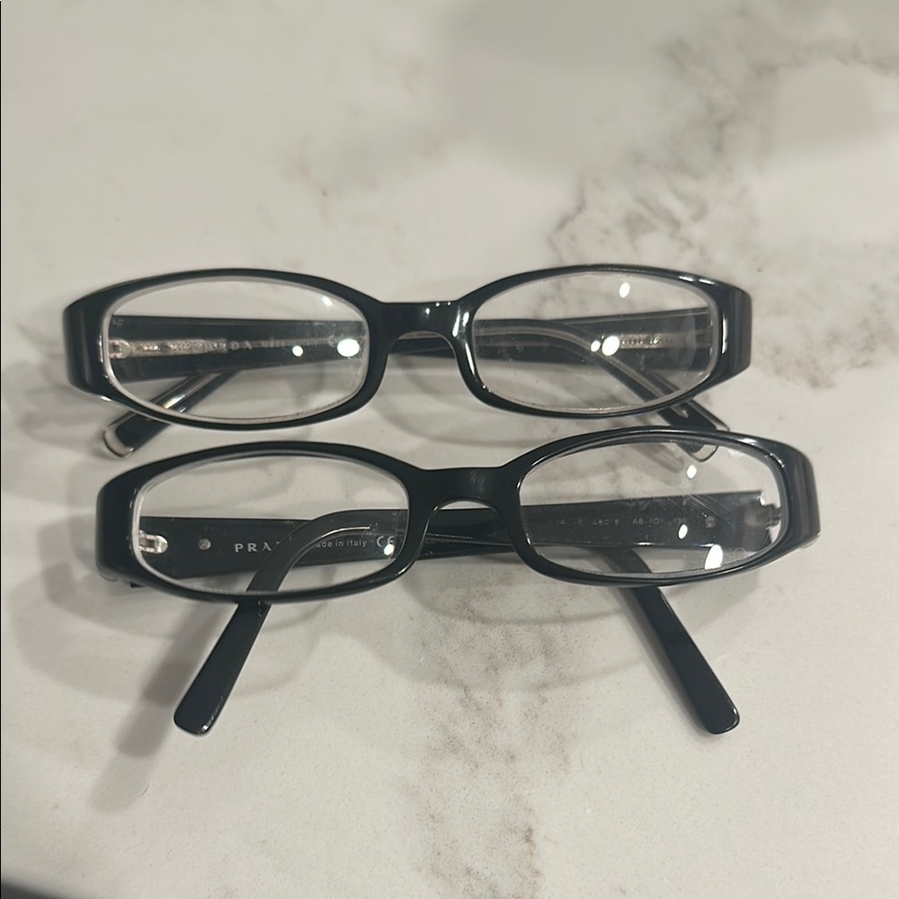 Prada Elegant Black Oval Eyeglasses